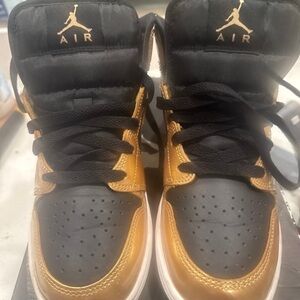 Jordan Black and Gold High-Top Sneakers
